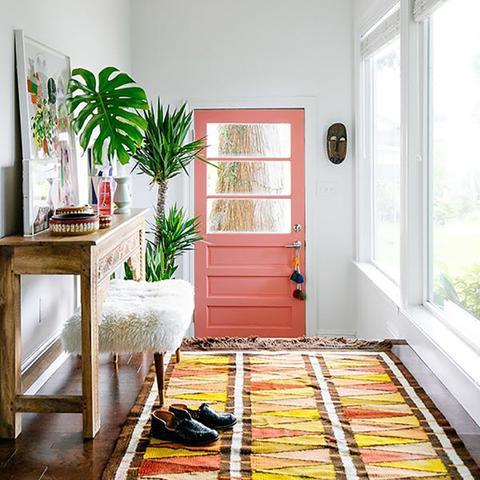 A front door painted with Benjamin Moore's 012 Coral Reef, available at Cincinnati Color Company in Ohio.