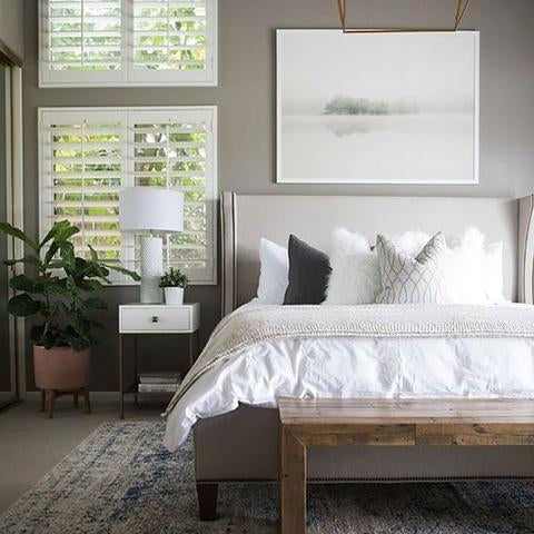 A bedroom wall painted with Benjamin Moore's 1475 Graystone, available at Cincinnati Color Company in Cincinnati, Ohio.