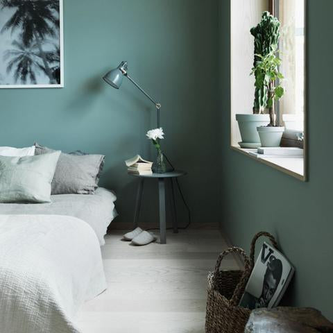 A bedroom painted with Benjamin Moore's 706 Cedar Mountains, paint color available at Cincinnati Color Company in Ohio.