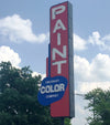 Red and blue Cincinnati Color Company exterior signage hanging outside in Cincinnati, OH.