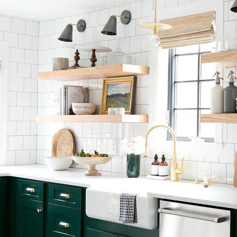 A kitchen with cabinets that have been painted with Benjamin Moore's 2047-10 Forest Green, available at Cincinnati Color Company in Cincinnati, Ohio.