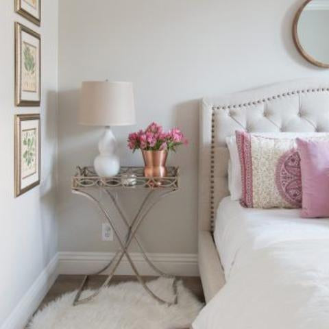 A bedroom wall painted with Benjamin Moore's OC-20 Pale Oak, available at Cincinnati Color Company in Cincinnati, Ohio.