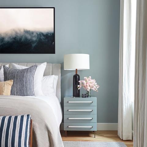 A bedroom wall painted with Benjamin Moore HC-149 Buxton Blue, paint color available at Cincinnati Color Company in Ohio.