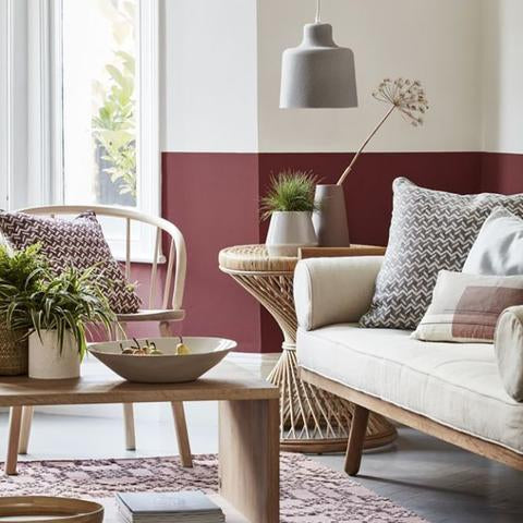 A living room with half of the wall painted with Benjamin Moore HC-61 New London Burgundy, available at Cincinnati Color Company in Ohio.