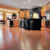 A kitchen with hardwood flooring and wooden cabinetry, finished with Mohawk Wood Finishing products.